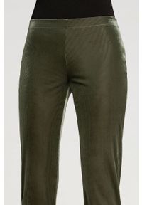 Wolford Spodnie damskie kolor zielony szerokie high waist. Stan: podwyższony. Kolor: zielony