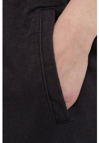 DKNY - Dkny spodnie DP1P2833 damskie kolor czarny z nadrukiem. Kolor: czarny. Wzór: nadruk #2