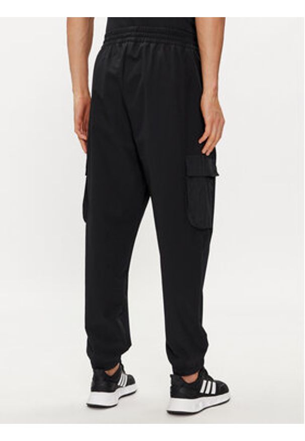 Adidas - adidas Spodnie dresowe City Escape IR5179 Czarny Regular Fit. Kolor: czarny. Materiał: syntetyk