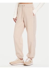 Guess Spodnie dresowe V5BB10 KB681 Beżowy Regular Fit. Kolor: beżowy. Materiał: syntetyk