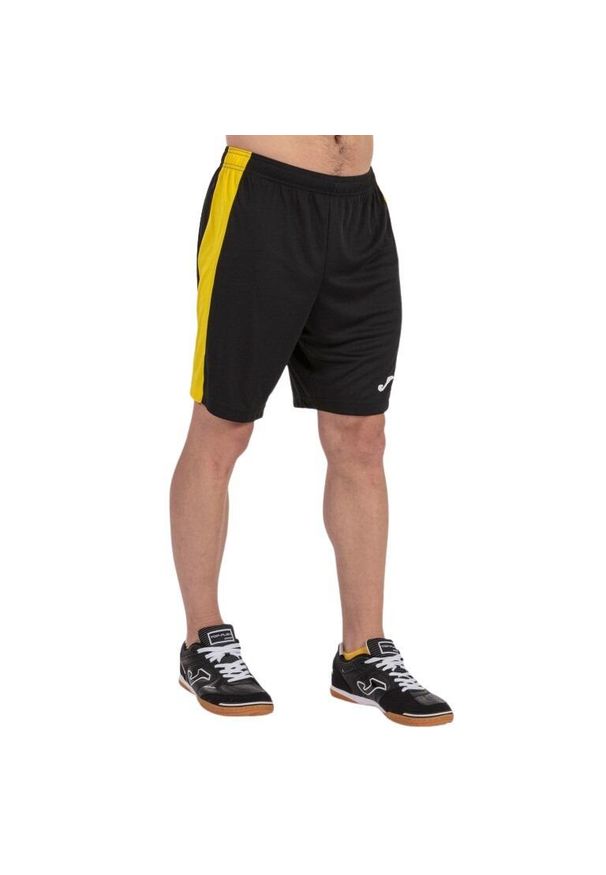 Spodenki do piłki nożnej męskie Joma Maxi. Kolor: wielokolorowy, żółty, czarny. Sport: piłka nożna