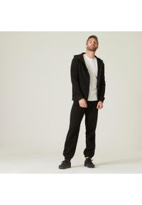 DOMYOS - Spodnie dresowe męskie Nyamba Gym & Pilates 500. Kolor: czarny. Materiał: dresówka. Wzór: ze splotem. Sport: joga i pilates #2
