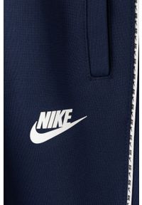 Nike Kids Spodnie dziecięce kolor granatowy gładkie. Kolor: niebieski. Materiał: dzianina. Wzór: gładki #2