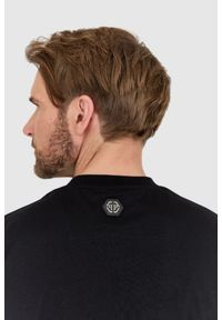 Philipp Plein - PHILIPP PLEIN Czarny t-shirt zdobiony dżetami z czaszką i logo. Kolor: czarny. Wzór: aplikacja