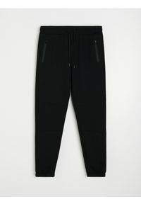 Sinsay - Spodnie dresowe slim fit z domieszką wiskozy - czarny. Kolor: czarny. Materiał: dresówka, wiskoza