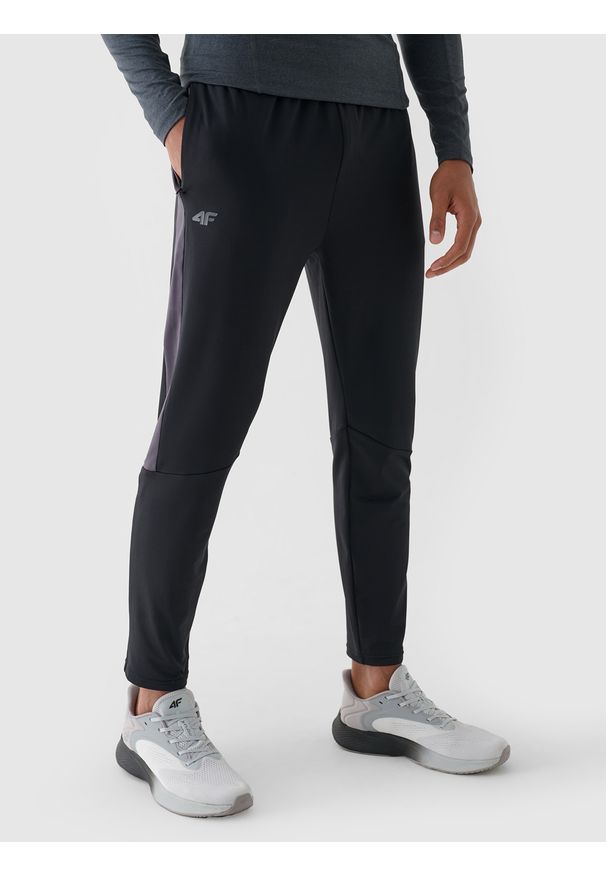 4f - 4F Spodnie treningowe szybkoschnące męskie - czarne XL. Kolor: czarny. Materiał: materiał, włókno, syntetyk, elastan. Wzór: jednolity. Sport: fitness