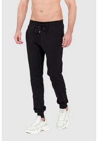 Dolce and Gabbana - DOLCE & GABBANA Czarne spodnie dresowe z haftowanym logo. Kolor: czarny. Materiał: bawełna. Wzór: haft #3
