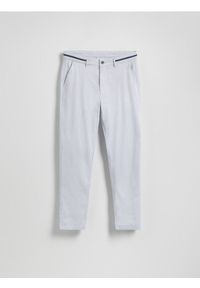 Reserved - Spodnie chino slim fit - jasnoniebieski. Kolor: niebieski. Materiał: bawełna, tkanina