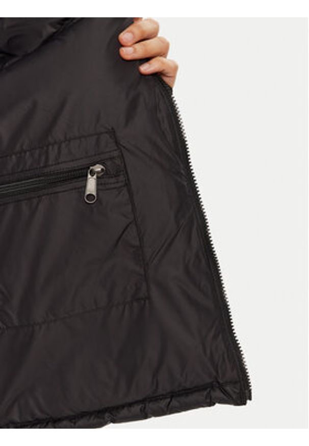 The North Face Bezrękawnik 1996 Retro Nuptse NF0A3XEP Czarny Regular Fit. Kolor: czarny. Materiał: syntetyk. Długość rękawa: bez rękawów. Styl: retro