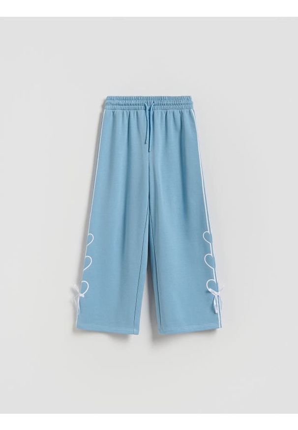 Reserved - Spodnie dresowe z kokardkami - jasnoturkusowy. Kolor: turkusowy. Materiał: dresówka