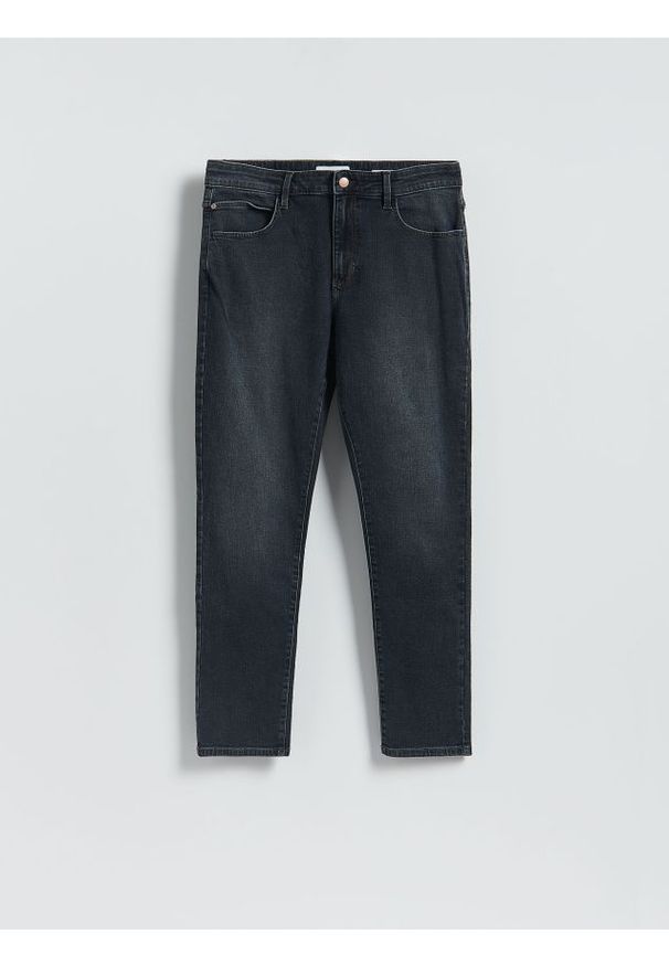 Reserved - Jeansy slim fit z efektem sprania - granatowy. Kolor: niebieski