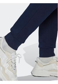 Adidas - adidas Spodnie dresowe adicolor Essentials Trefoil HK0185 Granatowy Slim Fit. Kolor: niebieski. Materiał: syntetyk, dresówka #6