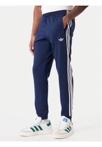 Adidas - adidas Spodnie dresowe 3-Stripes KE3561 Granatowy Slim Fit. Kolor: niebieski. Materiał: bawełna, syntetyk #1