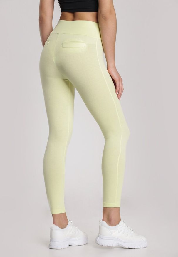 Renee - Żółte Legginsy Nealiria. Kolor: żółty. Materiał: dzianina. Długość: długie. Wzór: gładki. Styl: klasyczny