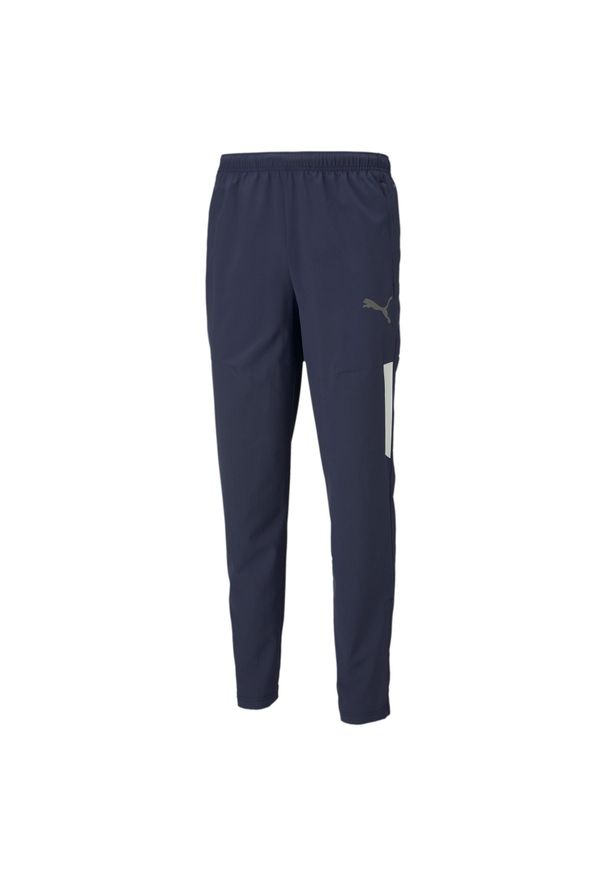 Spodnie treningowe męskie Puma Teamliga Sideline. Kolor: niebieski. Materiał: dresówka. Sport: piłka nożna