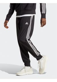Adidas - adidas Spodnie dresowe AEROREADY Essentials Tapered Cuff Woven 3-Stripes Joggers IC0041 Czarny Regular Fit. Kolor: czarny. Materiał: syntetyk #1