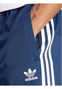 Adidas - adidas Spodnie dresowe adicolor Classics SST IR9887 Granatowy Slim Fit. Kolor: niebieski. Materiał: syntetyk, bawełna #2