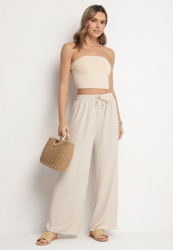 Born2be - Jasnobeżowe Szerokie Spodnie z Bawełną Ozdobione Wiązaniem Rosadira. Okazja: na co dzień. Kolor: beżowy. Materiał: bawełna. Wzór: aplikacja. Styl: klasyczny, casual