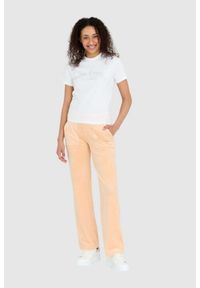Juicy Couture - JUICY COUTURE Klasyczne welurowe spodnie dresowe del ray w brzoskwiniowym kolorze. Kolor: pomarańczowy. Materiał: dresówka, welur #2