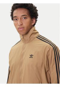 Adidas - adidas Bluza adicolor Woven Firebird JY1333 Beżowy Loose Fit. Kolor: beżowy. Materiał: syntetyk