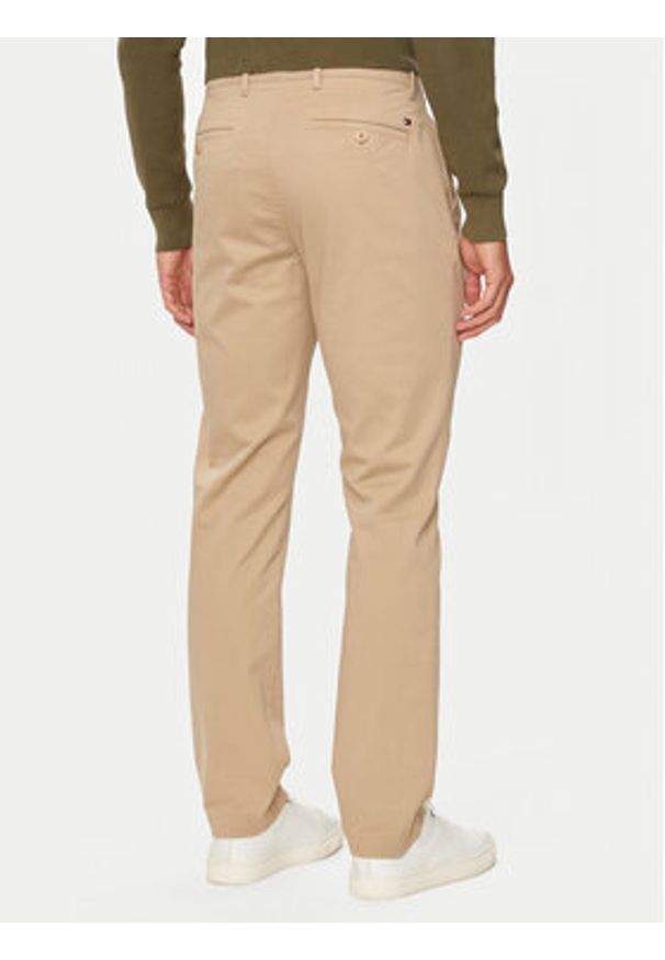 TOMMY HILFIGER - Tommy Hilfiger Chinosy Denton MW0MW37873 Beżowy Slim Fit. Kolor: beżowy. Materiał: bawełna