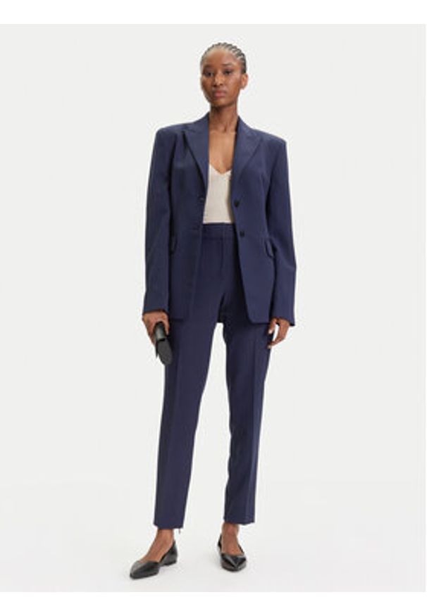 Hugo - HUGO Spodnie materiałowe Hedima-1 50544742 Granatowy Slim Fit. Kolor: niebieski. Materiał: syntetyk