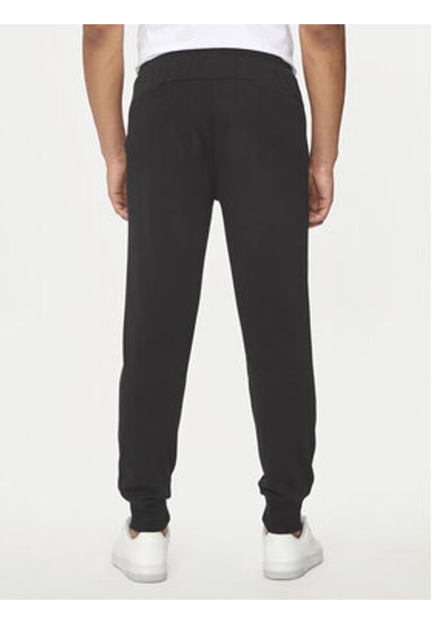 Puma Spodnie dresowe Ess Logo 586716 Czarny Regular Fit. Kolor: czarny. Materiał: bawełna, syntetyk