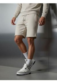 Sinsay - Szorty slim fit - beżowy. Kolor: beżowy