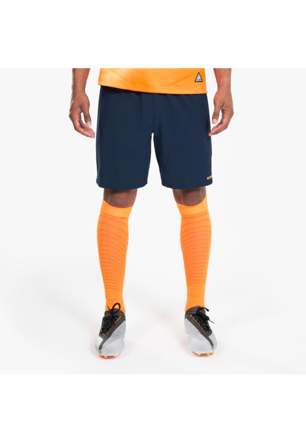 KIPSTA - Spodenki piłkarskie Kipsta CLR. Kolor: wielokolorowy, niebieski, pomarańczowy. Materiał: poliester, materiał, elastan. Sport: piłka nożna