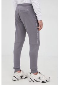 Calvin Klein Jeans Spodnie J30J319652.PPYY męskie kolor szary z nadrukiem. Kolor: szary. Materiał: włókno, dzianina. Wzór: nadruk #4