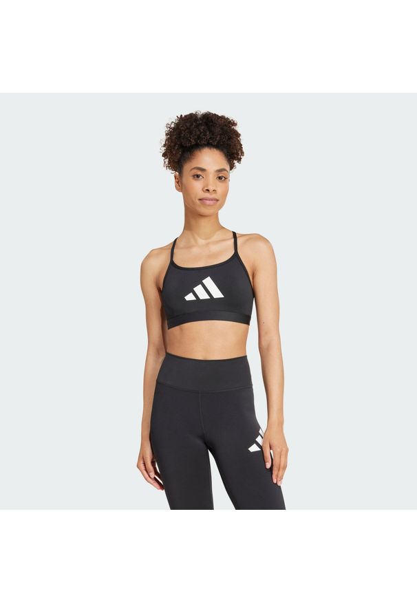 Adidas - Biustonosz Aeroreact Graphic. Kolor: czarny. Materiał: materiał. Sport: joga i pilates