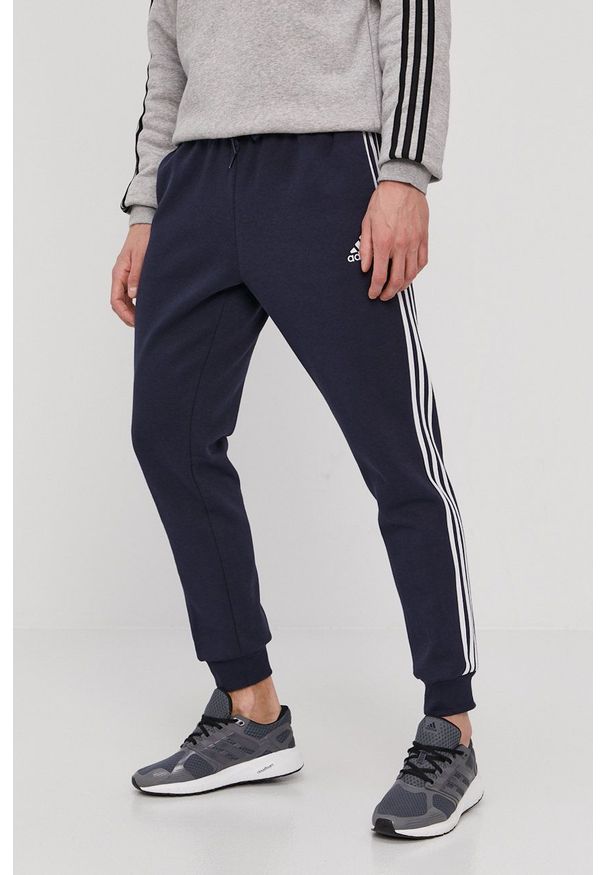 Adidas - adidas - Spodnie. Okazja: na co dzień. Kolor: niebieski. Materiał: dzianina, poliester. Styl: casual