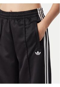 Adidas - adidas Spodnie dresowe Satin Sst KS9372 Czarny Loose Fit. Kolor: czarny. Materiał: syntetyk #4