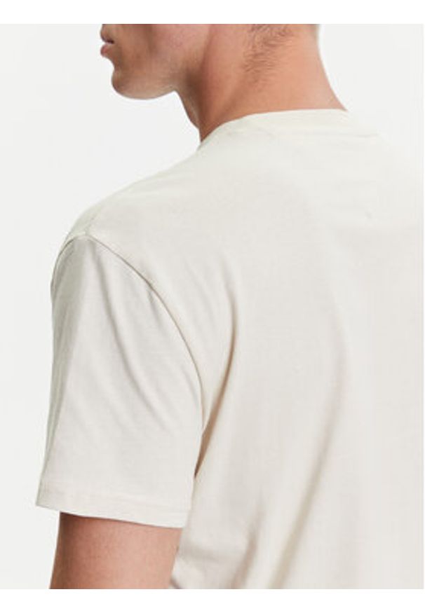 Tommy Jeans T-Shirt Linear Logo DM0DM20744 Beżowy Regular Fit. Kolor: beżowy. Materiał: bawełna