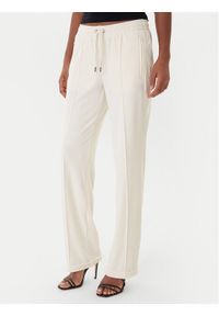Juicy Couture Spodnie dresowe Tina JCWBJ225307 Beżowy Regular Fit. Kolor: beżowy. Materiał: syntetyk #1