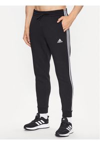 Adidas - adidas Spodnie dresowe IB3999 Czarny Slim Fit. Kolor: czarny. Materiał: bawełna