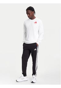 Adidas - adidas Spodnie dresowe Essentials 3-Stripes JE6430 Czarny Regular Fit. Kolor: czarny. Materiał: bawełna #4