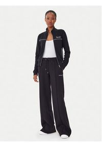 Guess Jeans Spodnie dresowe W5BB04 KC811 Czarny Wide Leg. Kolor: czarny. Materiał: bawełna