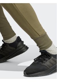 Adidas - adidas Spodnie dresowe Z.N.E. Premium IN5103 Zielony Regular Fit. Kolor: zielony. Materiał: dresówka, bawełna
