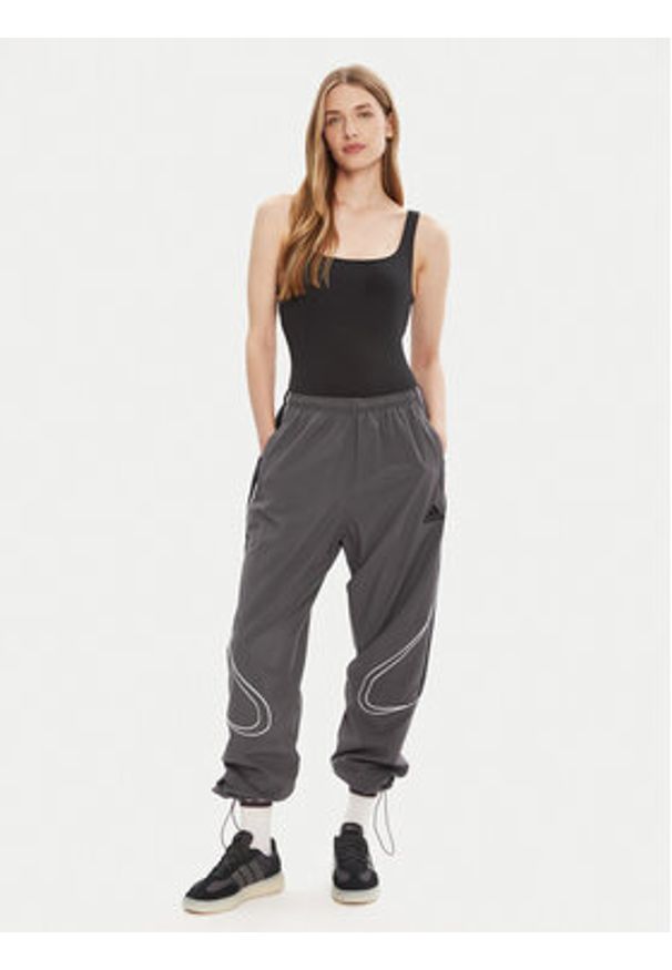 Adidas - adidas Spodnie dresowe Teamgeist adicolor JW5870 Szary Loose Fit. Kolor: szary. Materiał: syntetyk