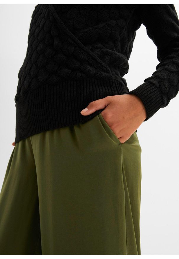 bonprix - Sweter ażurowy w optyce kopertowego. Kolor: czarny. Wzór: ażurowy