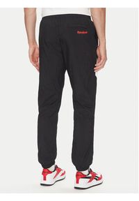 Reebok Spodnie dresowe 100223963 Czarny Regular Fit. Kolor: czarny. Materiał: syntetyk #4
