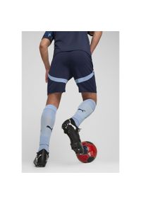 Szorty Puma RBS. Kolor: czerwony, wielokolorowy, niebieski. Materiał: poliester. Sport: piłka nożna