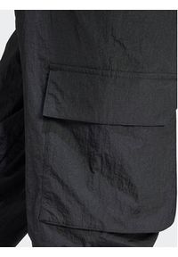 Adidas - adidas Spodnie dresowe City Escape IQ4826 Czarny Loose Fit. Kolor: czarny. Materiał: syntetyk #6