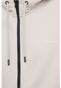 Calvin Klein bluza męska kolor beżowy z kapturem gładka. Okazja: na co dzień. Typ kołnierza: kaptur. Kolor: beżowy. Materiał: dzianina. Wzór: gładki. Styl: casual