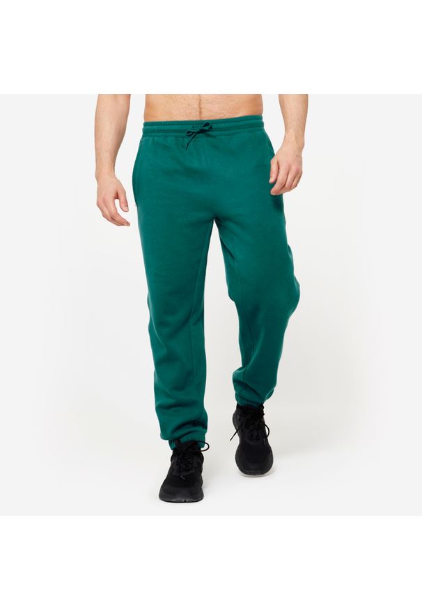 DOMYOS - Spodnie dresowe męskie Gym & Pilates - turkusowe. Kolor: zielony, niebieski, wielokolorowy. Materiał: materiał, poliester, bawełna. Wzór: ze splotem. Sezon: zima. Sport: joga i pilates