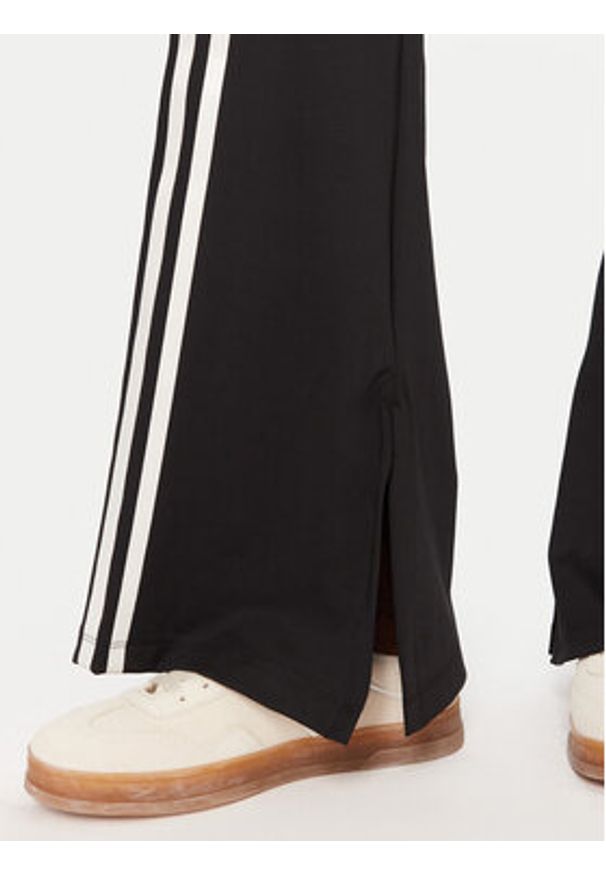 Adidas - adidas Legginsy Ribbon Off Placed 3-Stripes JX2697 Czarny Flared Fit. Kolor: czarny. Materiał: syntetyk