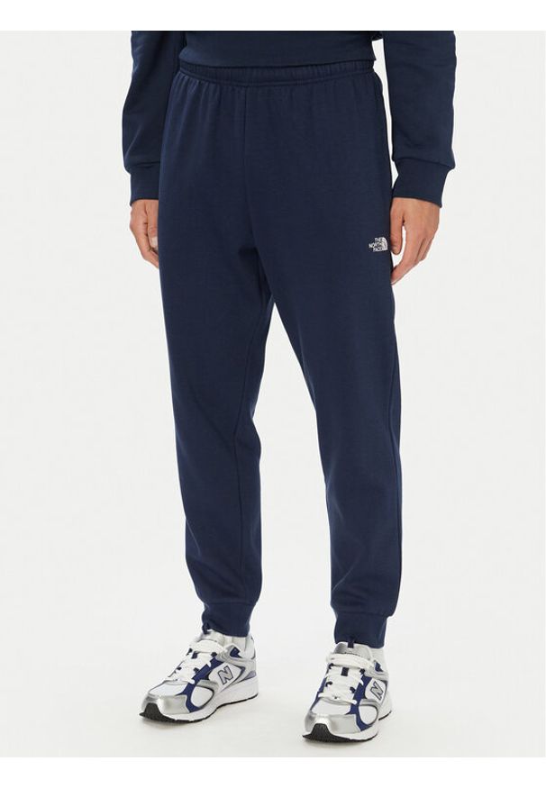The North Face Spodnie dresowe Evolution Simple Dome NF0A8CWY Granatowy Regular Fit. Kolor: niebieski. Materiał: bawełna