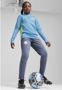 Puma - Młodzieżowe spodnie treningowe Manchester City PUMA Inky Blue Magic. Kolor: niebieski