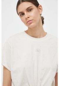 DKNY - Dkny t-shirt bawełniany kolor beżowy. Kolor: beżowy. Materiał: bawełna. Wzór: aplikacja